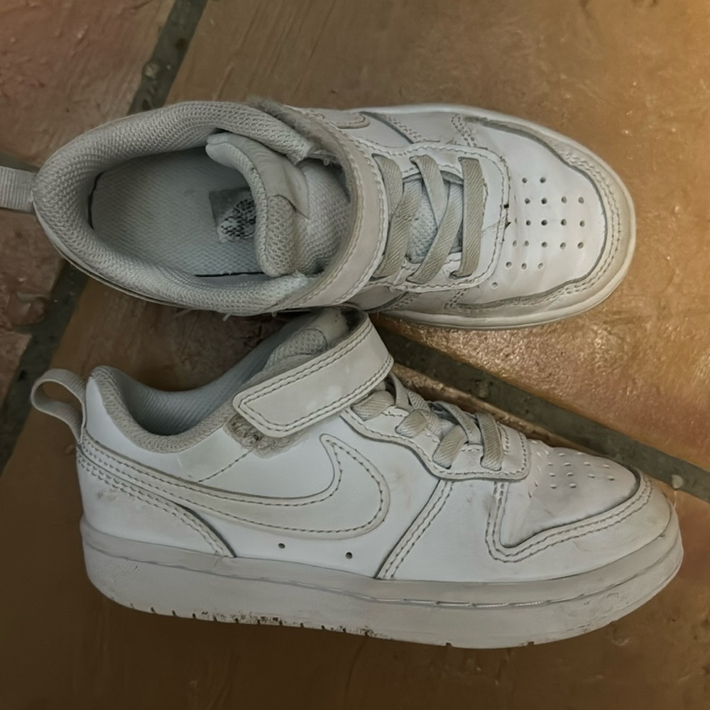 Kids white Nike sneakers